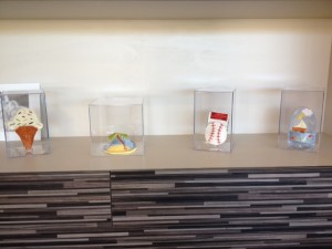Ceramic sculptures are on display on the table area in the building