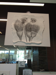 Sangalang's paintbrush sketch hung on the glass wall.  