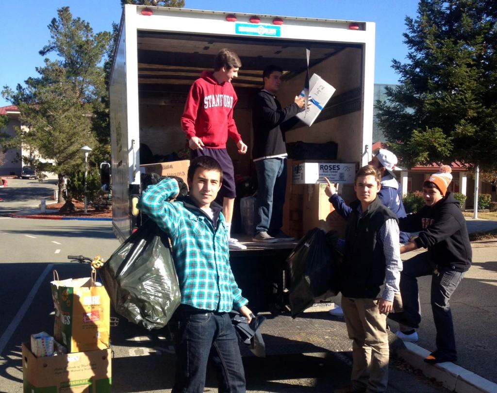 The leadership class loads up the Adopt-a-Family gifts into a truck to deliver to the Salvation Army. in 2013. Projects like these help students see the importance of giving back. 