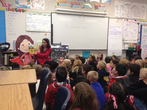 Paris shares one of her books with a third grade class at Vista Grande.