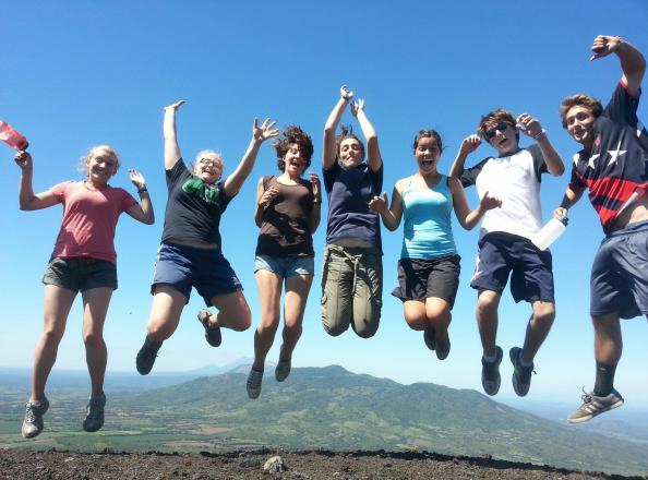 Students on the gap year program "Amigos de la America" jump for joy in Columbia. The program offers trips around South America for youth. 