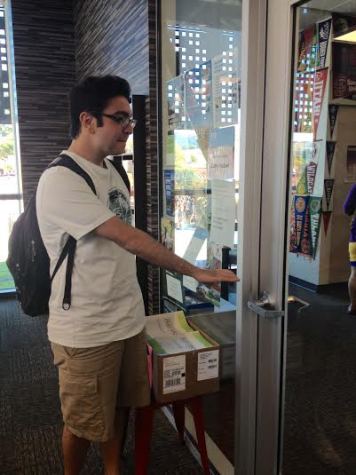 Junior Aria Fereydouni makes his way to Ms. Haberl's room to find out information on different colleges. Ms. Haberl is the college counselor and is located in the Work Day Student Center downstairs.