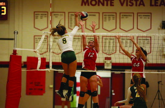 Blockers Sarah Thompson and Natalie Brooker block a spike in their final EBAL match against San Ramon on Nov. 6. The team lost that game in a hard fought battle, but still continues on in their fight to win NCS and possibly state. 