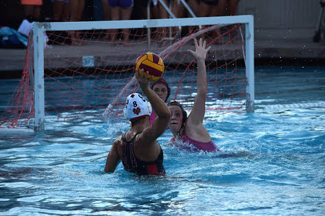 Senior captain Mackenzie Flath shoots and scores for the varsity women's water polo team.  The team has had an incredible season this year with only two losses, both to San Ramon.  They will move on to NCS seeded second and all are hoping for a first place finish.  