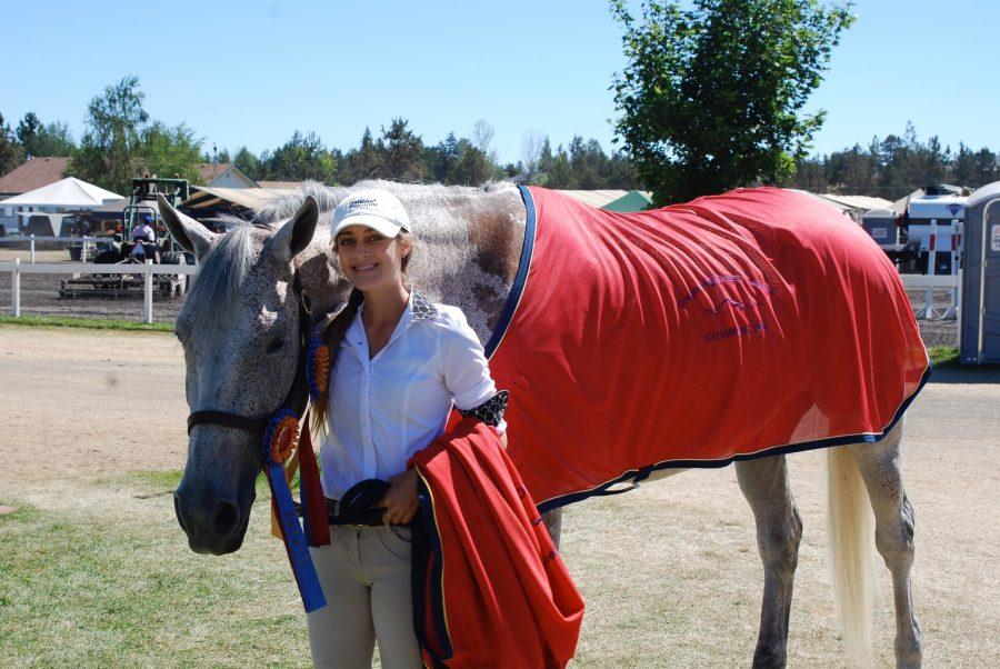 Kelsey Sarracino poses at a tournament with her horse, Kai.  She bought him this past spring in Canada.
(Courtesy of John Sarracino)
