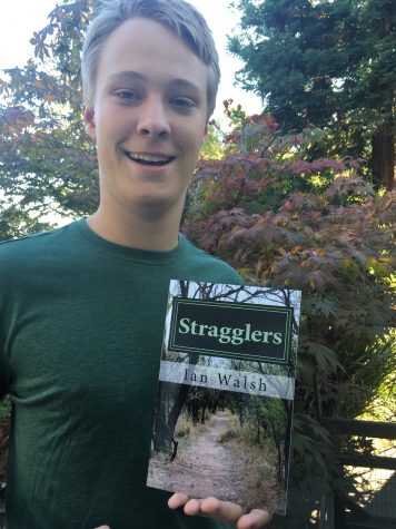 Ian Walsh, 15, with his book, Stragglers.