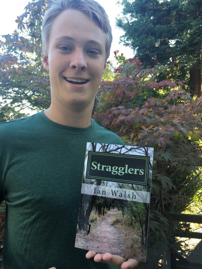 Ian Walsh, 15, with his book, Stragglers.