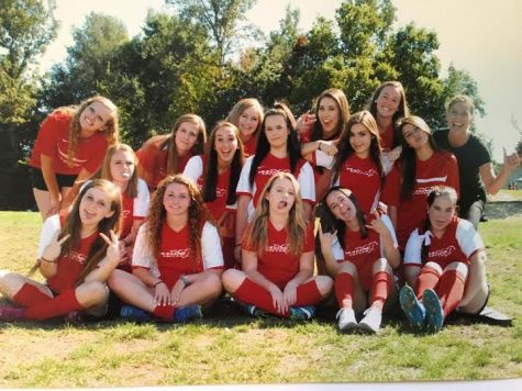 The players of the Cosmo soccer team and their coach pose for a sill photo. Most of the players played on the team from elementary school and stopped in high school, but many decided to come back and play one last time for their senior year. (Courtesy of Ashlyn Gonzales)