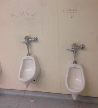 The graffiti was found in the boy's restroom in the 900 wing. This picture was tweeted out by ABC7 News Reporter Amy Hollyfield.