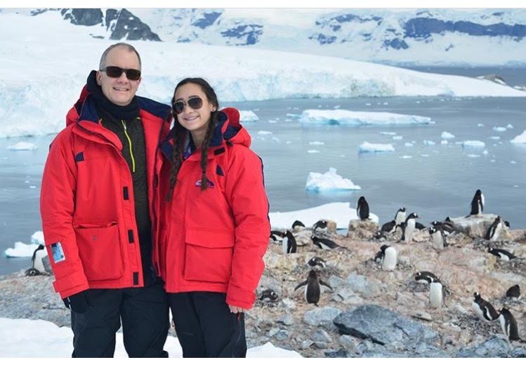Bella Romano, with her dad, in Antarctica with the penguins. She visited the untouched continent over winter break, living off of cold chicken in a boat, surrounded by icebergs and snow-capped mountains. (Courtesy of Bella Romano)