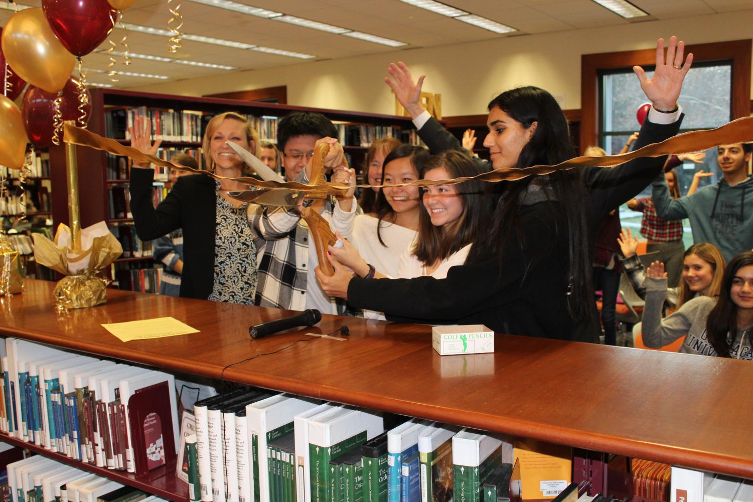 Teen Advisory Board members and Town Council members cut the ribbon officially opening the new Teen
Zone at the Danville Library.