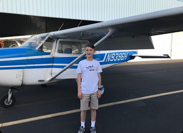 McCumiskey smiles before his first-ever flying lesson. He flew over Freemont with his flight instructor in a Cessna 172 Skyhawk.