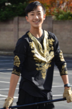 Monte Vista senior Nicholas Chong holding a flag and wearing his uniform for color guard. Chong is getting ready to perform  for the marching band event at Monte Vista.