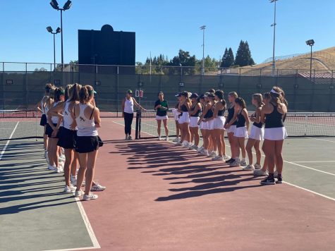 Monte Vista High School and San Ramon Valley High School Junior Varsity teams introduce their line-ups to one another before their match. 