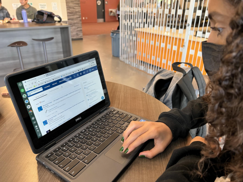 Sophomore Luana Veras is using her Chromebook to
access Schoology. She was checking her upcoming assignments in the Workday Student Center before school
started.