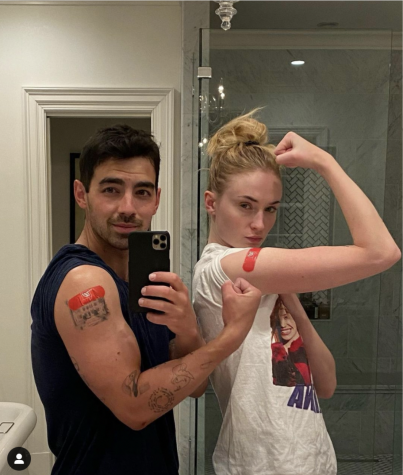 Joe Jonas and his wife, Sophie Turner flexing their vaccine bandaid. On April 8. 2021, Jonas and Turner received the COVID-19 vaccine.