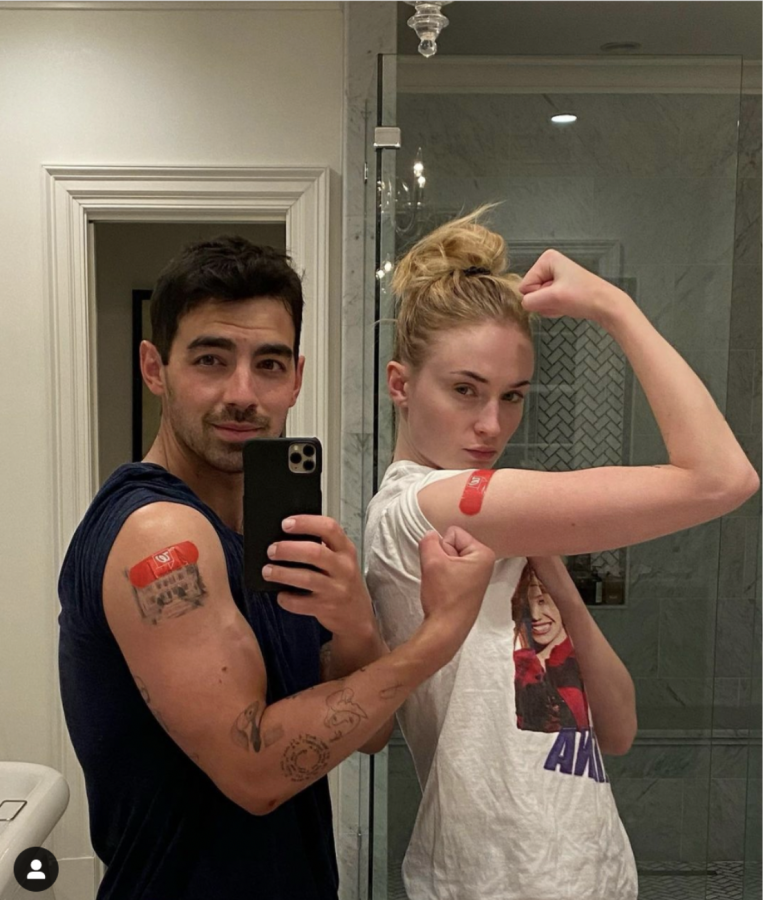 Joe+Jonas+and+his+wife%2C+Sophie+Turner+flexing+their+vaccine+bandaid.+On+April+8.+2021%2C+Jonas+and+Turner+received+the+COVID-19+vaccine.