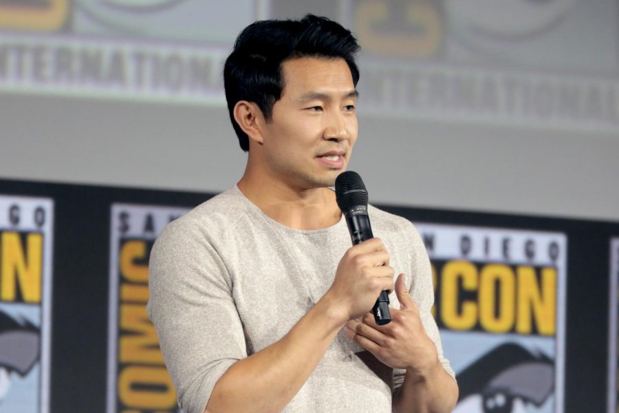 Simu Liu speaking at the 2019 San Diego Comic Con International. Simu Liu starred in Shang-Chi and the Legend of the Ten Rings as the first Asian lead in the Marvel Cinematic Universe