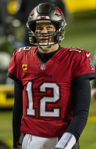 Tom Brady wearing his signature number 12 with the Tampa Bay Buccaneers. Brady would end up beating the Washington Football Team 31-23 in this game, and later go on to win his seventh super bowl.