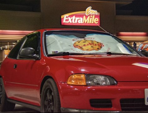 A candy-apple red 1995 Honda Civic hatchback EG flaunts its custom Lus Cookieez sunshade at a local gas station. This car belongs to non-other then Lus Cookieez owner Jacob Mangahas-Lu and was one of his main motives behind founding Lus. 