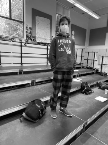 Will Last, senior, wears the classic red and black plaid pajamas. As pajamas are becoming part of daily school fashion, these pants are becoming the new Air Force Ones.