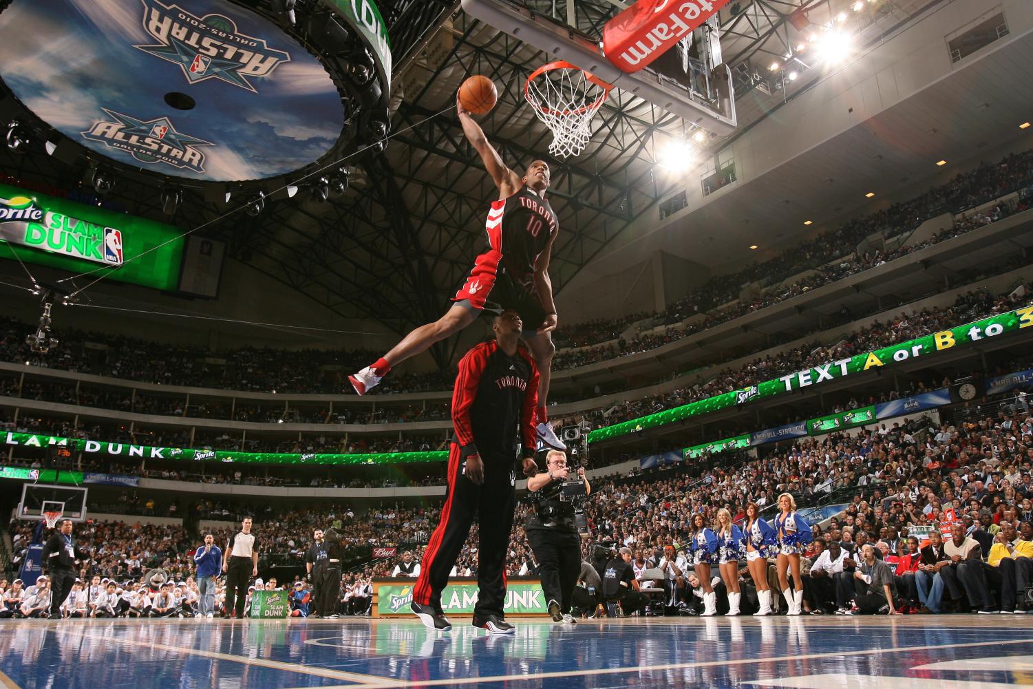Demar Derozen of the Toronto Raptors dunks over teammate Sony Weems during the 2010 Dunk Contest in Dallas. Now, when players perform dunks like this, the crowd has little reaction.