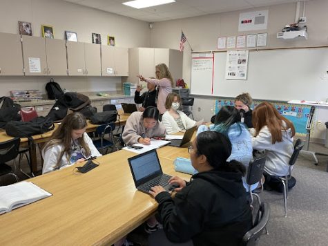 Students are working on homework from other classes while being in Child Development. Only six people, including the three teachers in the class, were wearing their masks. 