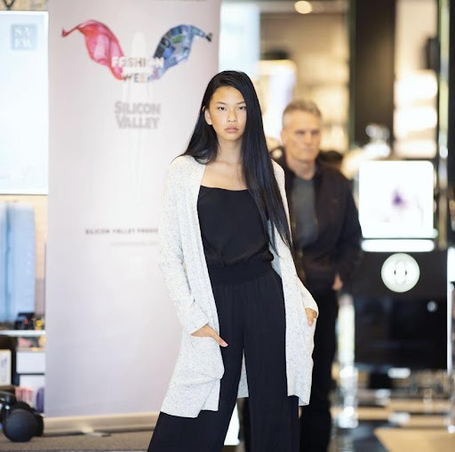 Huang is seen walking the runway at Silicon Valley Fashion Week in 2019. This show was promoting Maje Paris in Bloomingdales.
