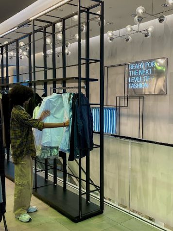Monte Vista freshman, Vikram Bhandari, is shopping fast fashion at H&M. Fast fashion companies offer trendy pieces at affordable prices to attract customers, including Bhandari, but at the expense of others and the environment. 