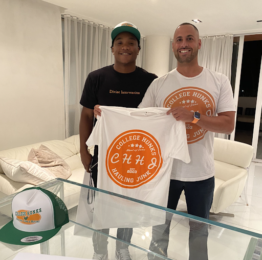 Miami Hurricanes quarterback D’Eriq King, from the University of Miami, signing an NIL deal with Omar Solimon, co-founder of College H.U.N.K.S.