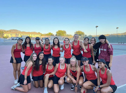 Monte Vista’s Women’s Varsity Tennis team is taking a group photo after their first win of the 2022-2023 season against Carondelet. They played over eighteen games in the entire regular season and came out undefeated.