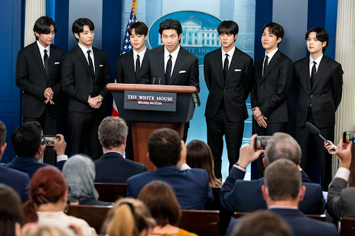 BTS is officially announcing their military service commitment. Their military leave was nearing its termination.
