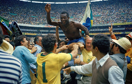 Famous soccer player Pelé celebrating with the Brazil national soccer team. He had just led Brazil to their third World Cup win in 1970 against Italy in Mexico City, Mexico. 
