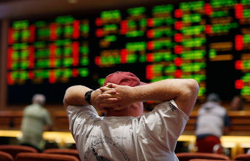 A man's reaction after losing money sports gambling. Sports gambling has become an increasingly popular pass time for many people. 