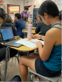 Junior Grace Tseng works on homework during student support. She was in Mr. Pang’s class studying for math. 
