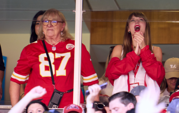 Taylor Swift and Travis Kelce’s mother, Donna Kelce, stand to cheer for Travis from their private viewing box. Swift has attended three Kansas City Chiefs games so far.
