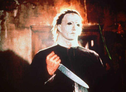 Michael Meyers holding a knife in “Halloween 5: The Revenger of Michael”. Meyers and his mask has been an infamous face in American media since 1978. 

