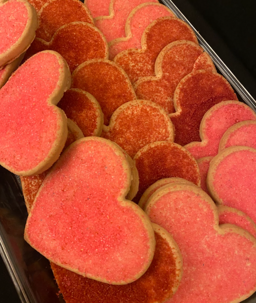 Homemade heart-shaped red and pink cookies.