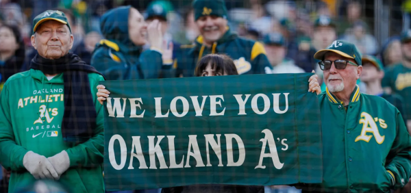 Oakland As fans sporting a We Love you OAKLAND As banner at a game in the Oakland Coliseum. The As will be playing their final season in the stadium and in Oakland before they head to Las Vegas in the near future.
