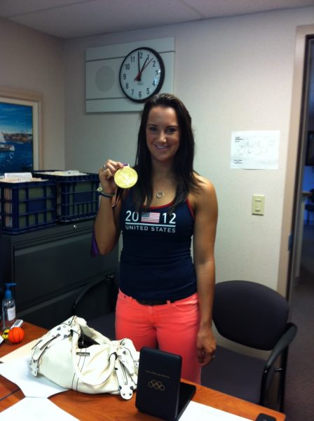 Maggie Steffens at Monte Vista office showing her gold medal.  Team USA won the 2012 London Olympics.