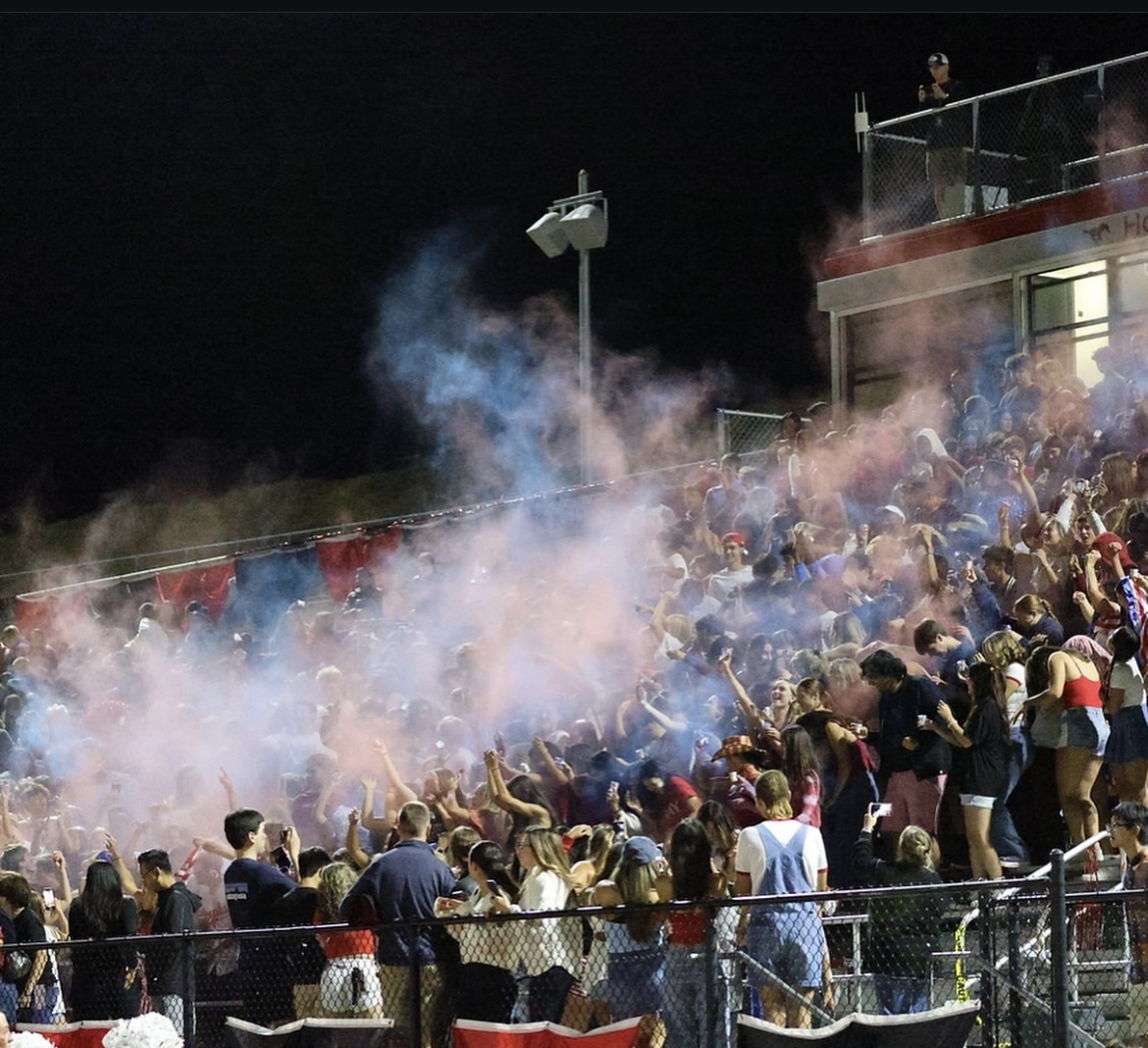 The Monte Vista Student Section during the 2024 varsity homecoming game. Students were throwing colored powder as a way to raise school spirit throughout the crowd. Image courtesy of Randy Helms.