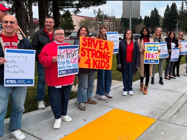 Teachers gather on the sidewalk along Stone Valley Road in front of the senior parking lot holding signs to raise awareness about the direct impact SRVUSD budget cuts will have on students.
