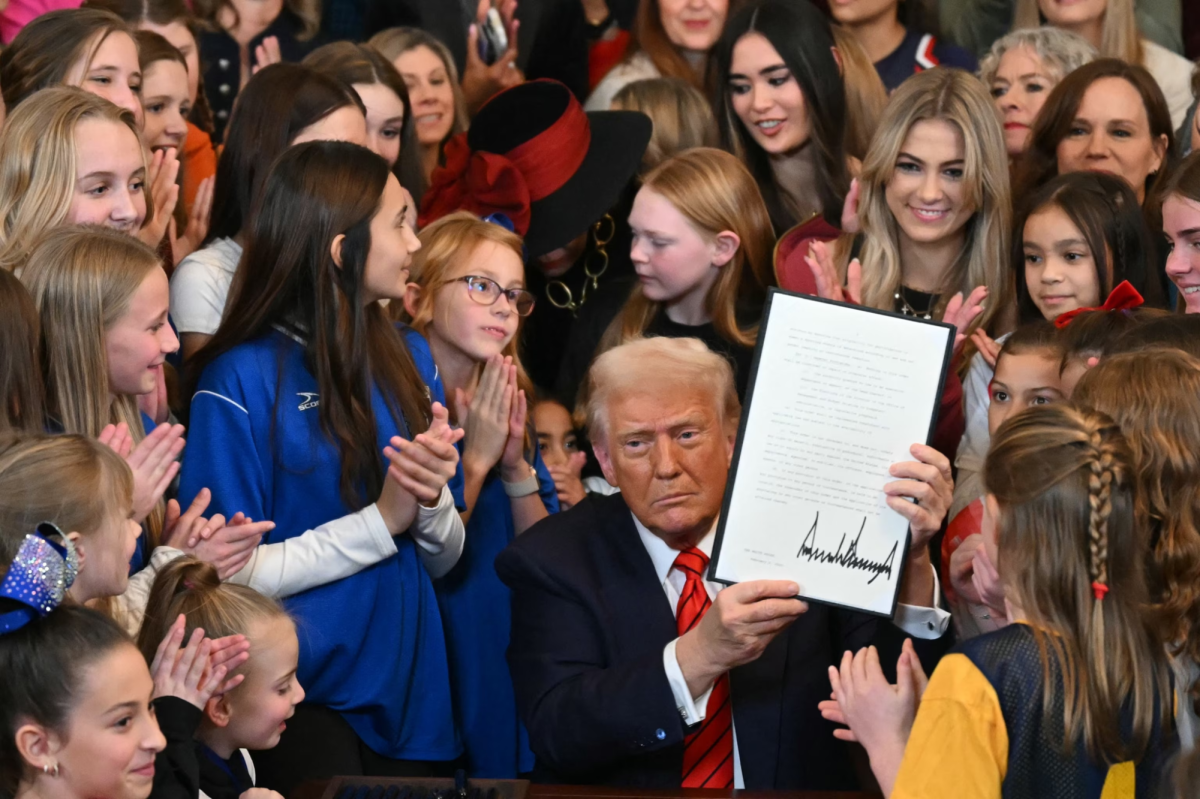 Trump signing executive orders alongside children (ABC News) 